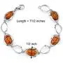 Peora Genuine Baltic Amber Bracelet for Women in Sterling Silver, Rich Cognac Color, Floating Oval Shape, 7 1/2 inches Length Peora Genuine Baltic Amber Bracelet for Women in Sterling Silver, Rich Cognac Color, Floating Oval Shape, 7 1/2 inches Length
