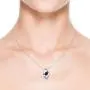 September Birthstone - Shell Style Oval Sapphire and Diamond Pendant Necklace in Silver (4x3mm Blue Sapphire) September Birthstone - Shell Style Oval Sapphire and Diamond Pendant Necklace in Silver (4x3mm Blue Sapphire)