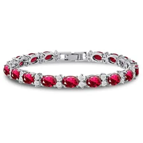 KEZEF CZ Tennis Bracelet - Oval 7x5 CZ & Round 2.50mm White CZ - Silver Over Brass - 7 Inch KEZEF CZ Tennis Bracelet - Oval 7x5 CZ & Round 2.50mm White CZ - Silver Over Brass - 7 Inch