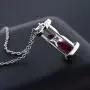 Gem Stone King 925 Sterling Silver Ruby Dust Hourglass Pendant Necklace For Women (0.75 Cttw with 18 Inch Silver Chain) Gem Stone King 925 Sterling Silver Ruby Dust Hourglass Pendant Necklace For Women (0.75 Cttw with 18 Inch Silver Chain)