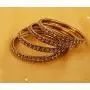 Touchstone New Indian Bollywood Fine Workmanship Peeled Metal White Rhinestones Designer Jewelry Bracelets Bangle Set of 4 in Antique Gold Tone for Women.