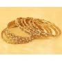 Touchstone New Golden Bangle Collection Indian Bollywood Charming Look Embellished with Yellow Color Rhinestone Thin Designer Jewelry Bangle Bracelets Set of 12. in Antique Gold Tone for Women.
