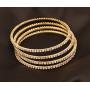 Touchstone ''Golden Bangle Collection Traditional Slim Single Line Clear Rhinestone Indian Bollywood Designer Jewelry Metal Bangle Bracelets in Antique Gold Tone for Women. Set of 4.