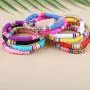 The Woos 10Pcs Colorful Polymer Clay Bracelets Handmade Rainbow Disc Bead Elastic Rope Stretch Bracelets Boho Beaded Bracelet Set Summer Beach Surf Stackable Jewelry for Women Girl