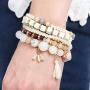 RIAH FASHION Multi Layer Versatile Statement Bracelets - Stackable Beaded Strand Stretch Bangles Sparkly Crystal, Wood Bead, Tassel Charm Pendant