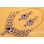 Touchstone Indian Bollywood Traditional Floral Theme White Rhinestone and Blue Faux Sapphire Bridal Designer Jewelry Necklace Set for Women in Antique Gold Tone