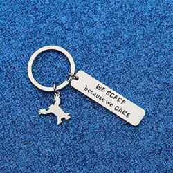 WUSUANED We Scare Because We Care Keychain with Monster Charm Movie Lover Jewelry Gift for Movie Fan Best Friend